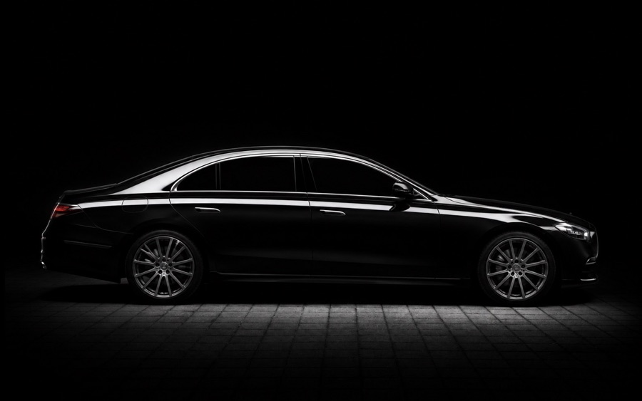 A black executive car available through ShuttleMe